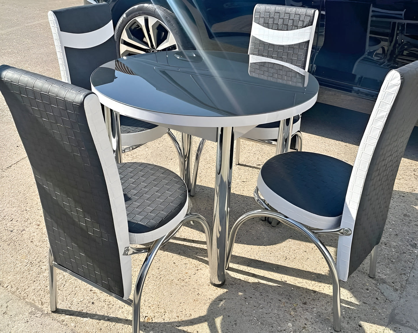 Round Glass And Steel Dining Table With 4 Faux Leather Chairs